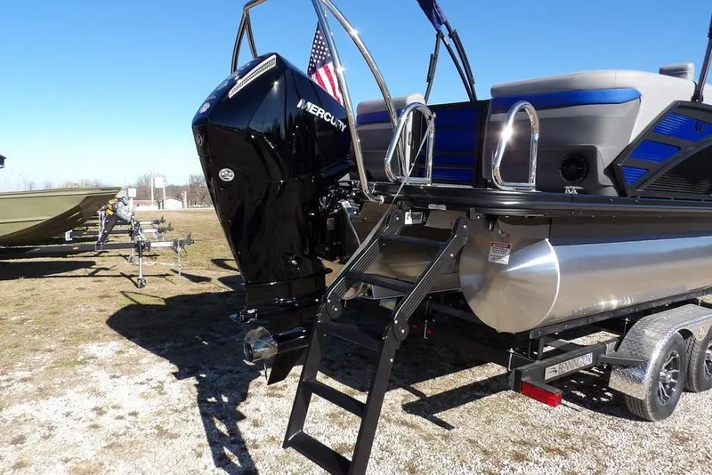 Slide: The Image of 2026 Bennington M Quad Bench 22 MFB pontoon boat with Mercury engine and trailer. - 41