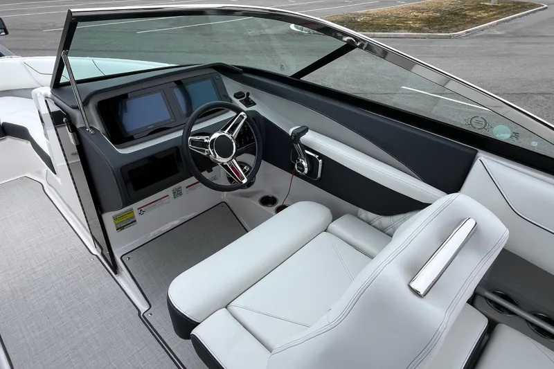 Slide: The Image of 2025 Regal LS4 boat interior with modern dashboard and luxurious white seating. - 5