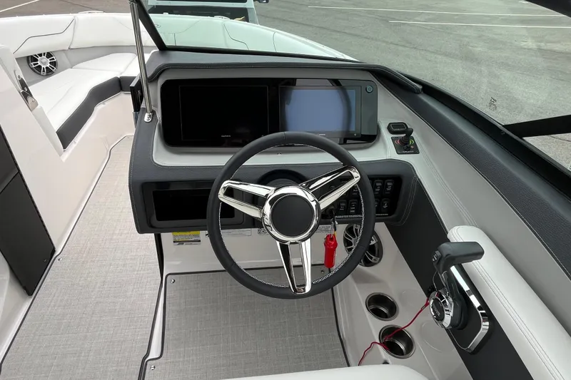 Slide: The Image of 2025 Regal LS4 boat cockpit with modern steering wheel and control panel. - 6