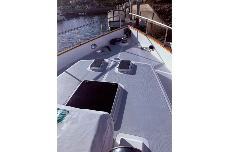 Slide: The Image of Bow view of 1989 Nordhavn 46 yacht docked at marina. - 12