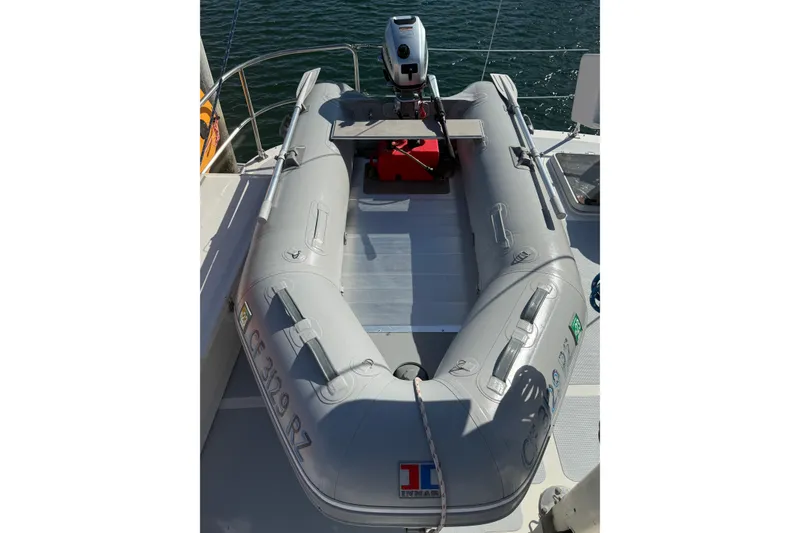 Slide: The Image of Inflatable dinghy on 1989 Nordhavn 46 yacht, equipped with an outboard motor. - 15