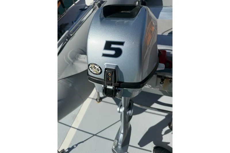 Slide: The Image of Outboard motor on a 1989 Nordhavn 46 yacht, featuring a silver casing with a "5" label. - 18