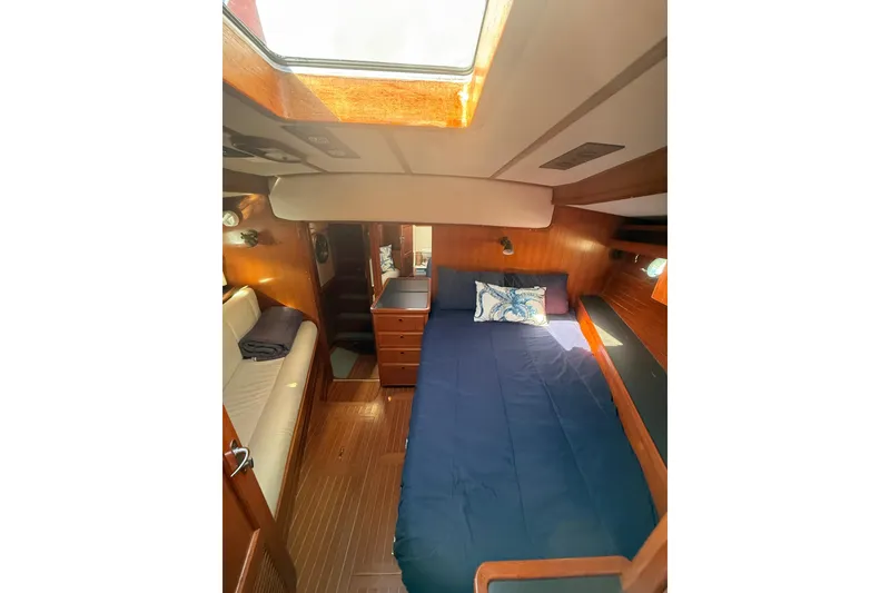 Slide: The Image of Cozy cabin interior of 1989 Nordhavn 46 yacht with bed and seating area. - 25