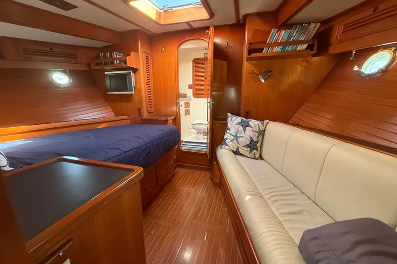 Slide: The Image of Luxurious 1989 Nordhavn 46 yacht interior with cozy cabin, bed, and seating area. - 26