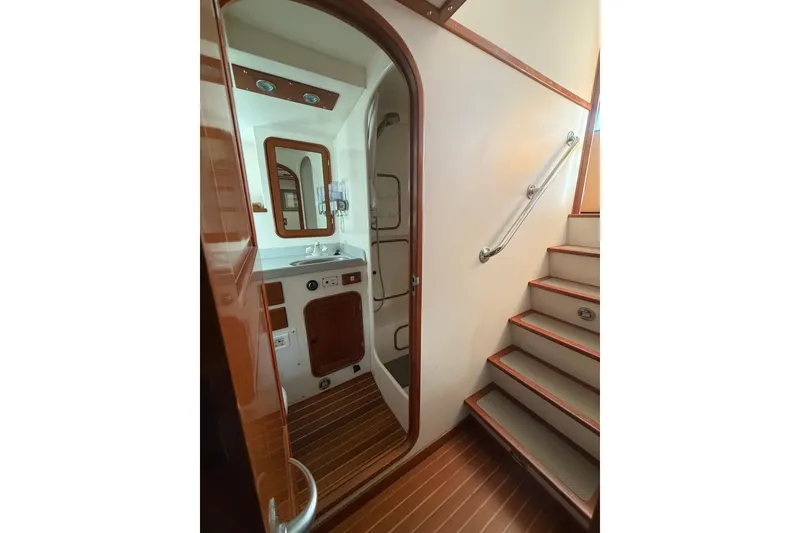 Slide: The Image of Interior of 1989 Nordhavn 46 yacht, featuring a bathroom and staircase. - 28