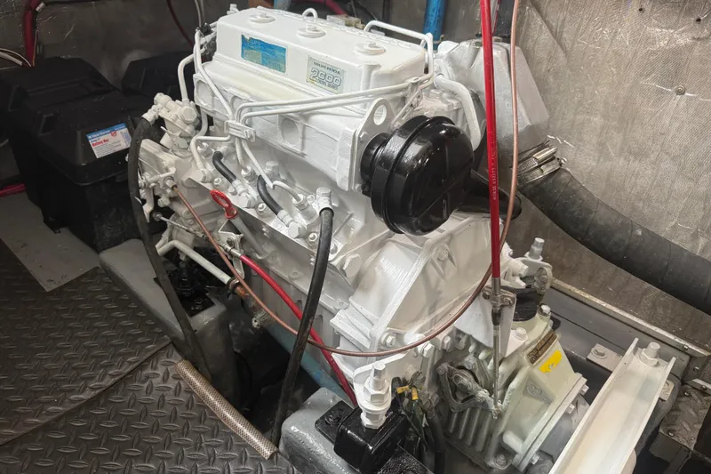 Slide: The Image of Engine room of a 1989 Nordhavn 46 yacht, featuring a Volvo Penta engine. - 33