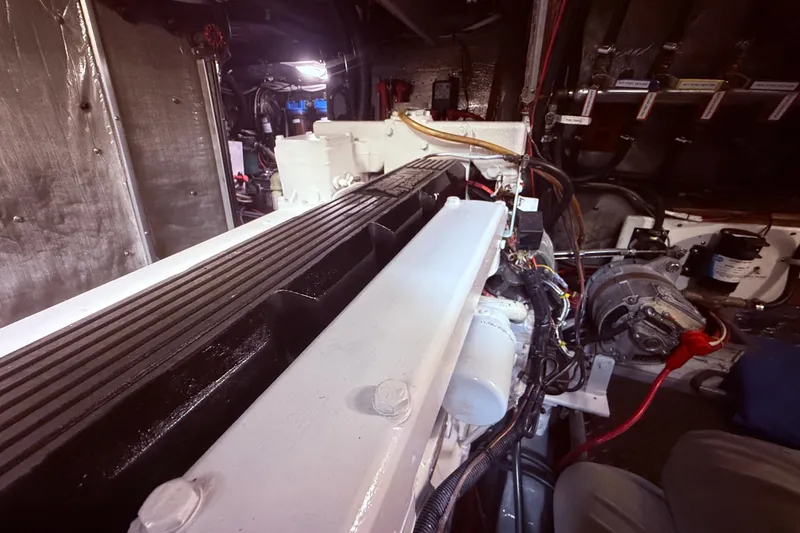 Slide: The Image of Engine room of a 1989 Nordhavn 46 yacht, showcasing mechanical components and wiring. - 36