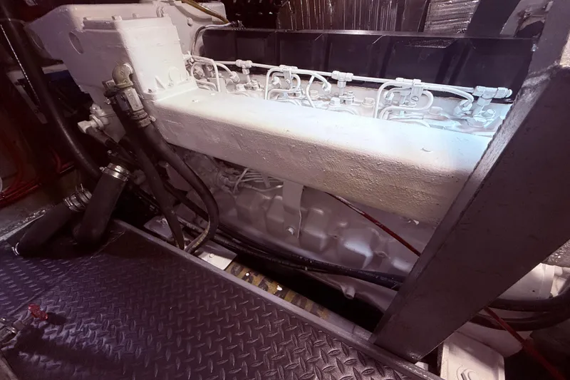 Slide: The Image of Engine room of a 1989 Nordhavn 46 yacht, showcasing mechanical components. - 38