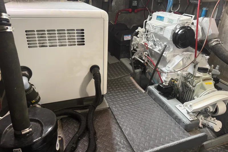 Slide: The Image of Engine room of a 1989 Nordhavn 46 yacht, featuring machinery and equipment. - 39