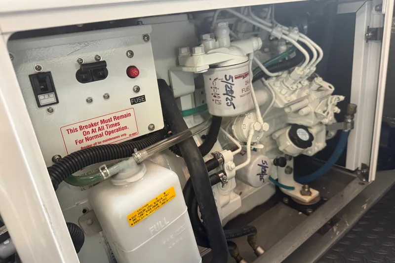 Slide: The Image of Engine compartment of a 1989 Nordhavn 46, featuring control panel and fuel system components. - 40