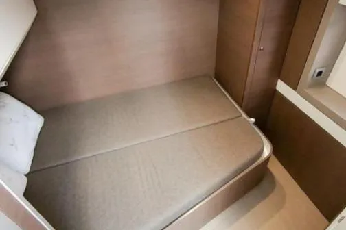 Slide: The Image of Compact cabin interior of 2021 Bali 5.4 yacht with cozy bed and wooden finish. - 10