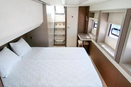 Slide: The Image of Luxurious cabin interior of 2021 Bali 5.4 yacht with bed and windows. - 11