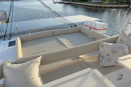 Slide: The Image of Luxurious 2021 Bali 5.4 yacht with spacious deck seating and scenic waterfront view. - 22