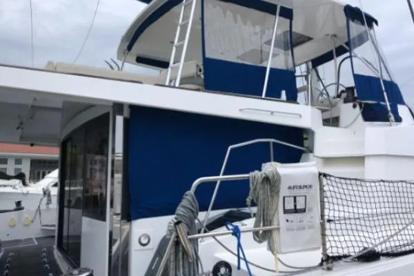 Slide: The Image of 2021 Bali 5.4 yacht with blue canopy and modern design features. - 24