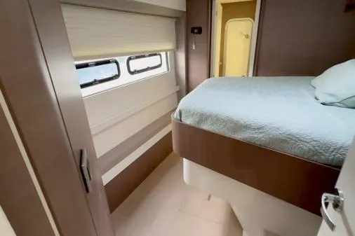 Slide: The Image of Interior of 2021 Bali 5.4 yacht cabin with bed and window. - 8