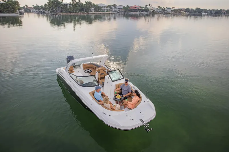 Slide: The Image of 2026 Hurricane SunDeck 2690 OB boat with passengers enjoying a calm lake view. - 17