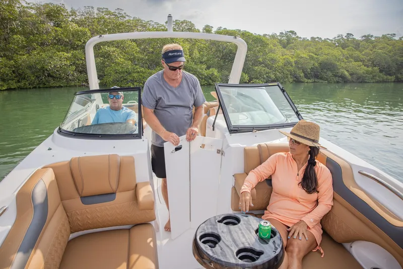 Slide: The Image of 2026 Hurricane SunDeck 2690 OB boat with passengers enjoying a relaxing day on the water. - 18