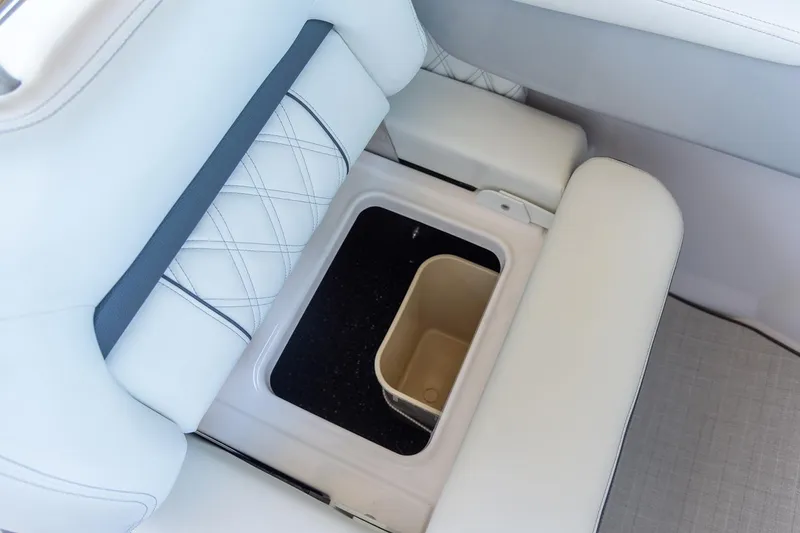 Slide: The Image of Manufacturer Provided Image: Storage compartment in 2026 Regal LX2 boat, featuring sleek design and cup holder. - 7