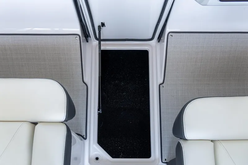 Slide: The Image of Manufacturer Provided Image: Interior of 2026 Regal LX2 boat featuring modern dashboard and storage compartments. - 9