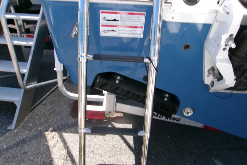 Slide: The Image of 2025 Sportsman Open 252 Center Console boat ladder and stern details. - 19