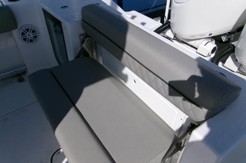 Slide: The Image of 2025 Sportsman Open 252 Center Console boat seating area with gray upholstery. - 8