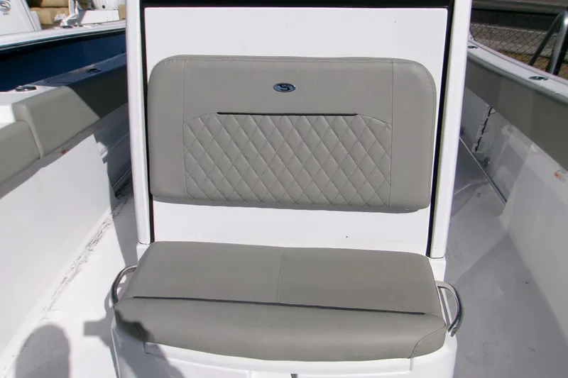 Slide: The Image of 2025 Sportsman Open 252 Center Console boat seat with gray cushioned upholstery. - 9