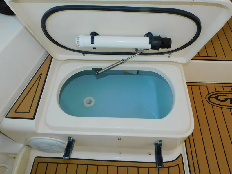 Slide: The Image of Grady-White Gulfstream 232 2012 boat compartment with open lid. - 15