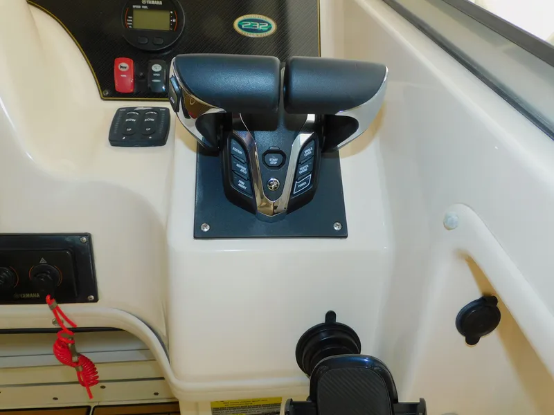 Slide: The Image of 2012 Grady-White Gulfstream 232 boat controls and dashboard. - 21