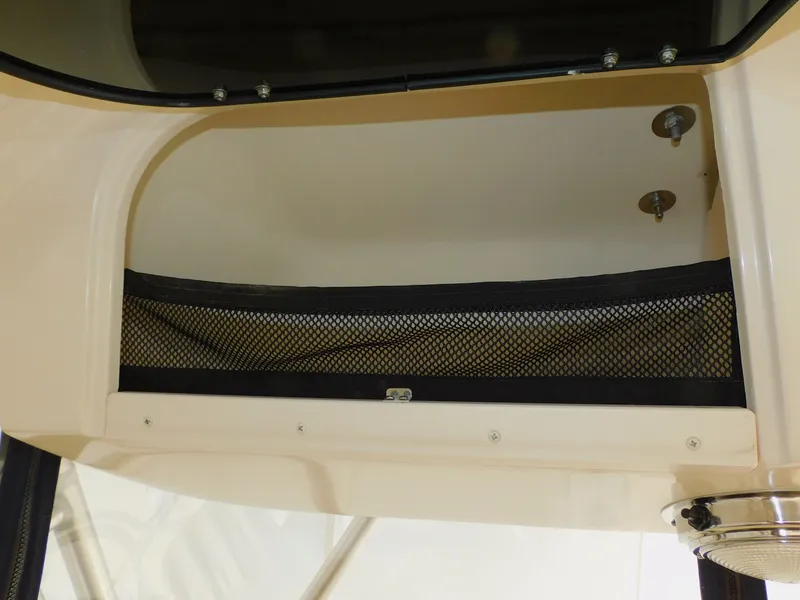 Slide: The Image of Grady-White Gulfstream 232, 2012, storage compartment with netting. - 36