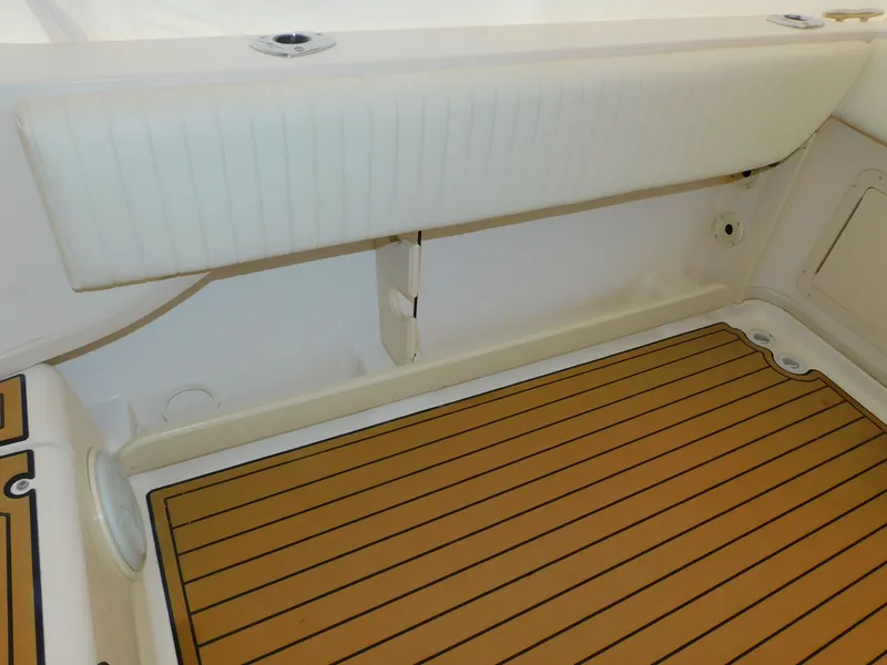 Slide: The Image of Grady-White Gulfstream 232, 2012, interior view with cushioned seat and wooden floor. - 44