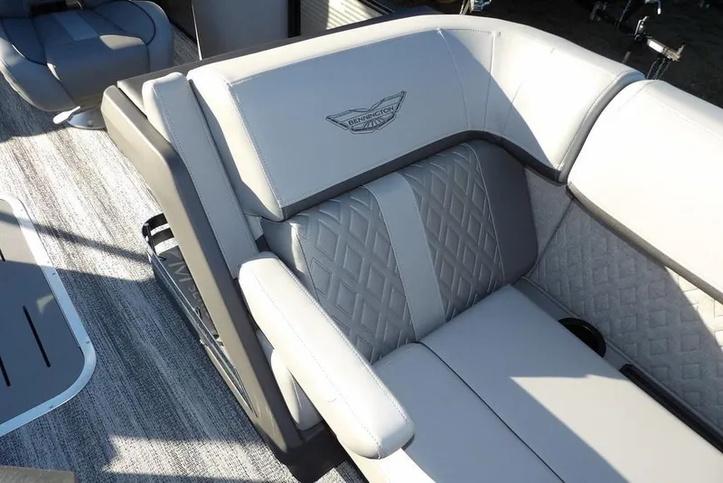 Slide: The Image of 2026 Bennington M Swingback 22 MSB boat interior with luxurious gray seating. - 12