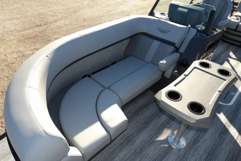 Slide: The Image of 2026 Bennington M Swingback 22 MSB boat interior with luxurious seating and cup holders. - 15