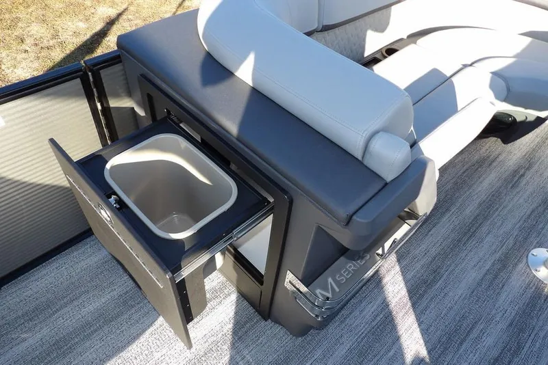 Slide: The Image of 2026 Bennington M Swingback 22 MSB boat interior with open storage compartment. - 16