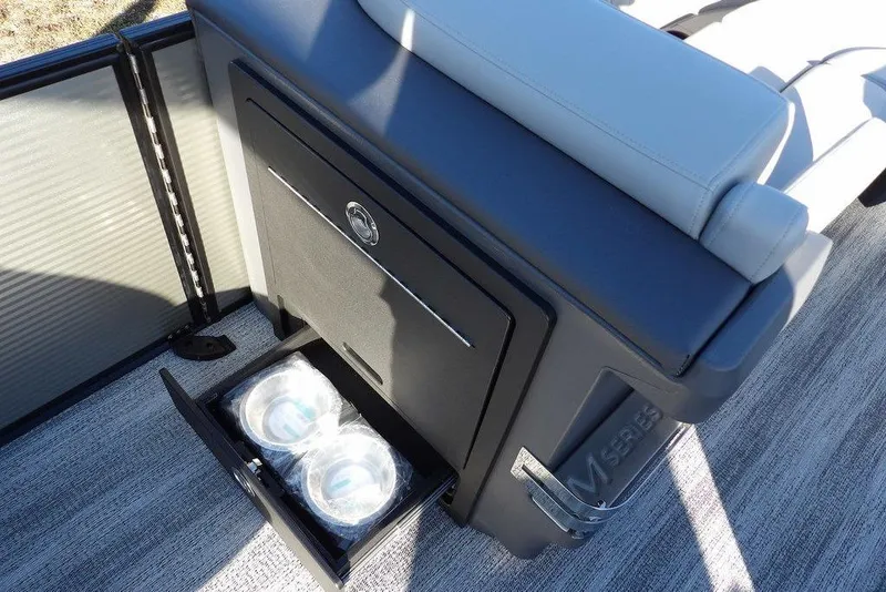 Slide: The Image of 2026 Bennington M Swingback 22 MSB boat interior with storage compartment and seating. - 18