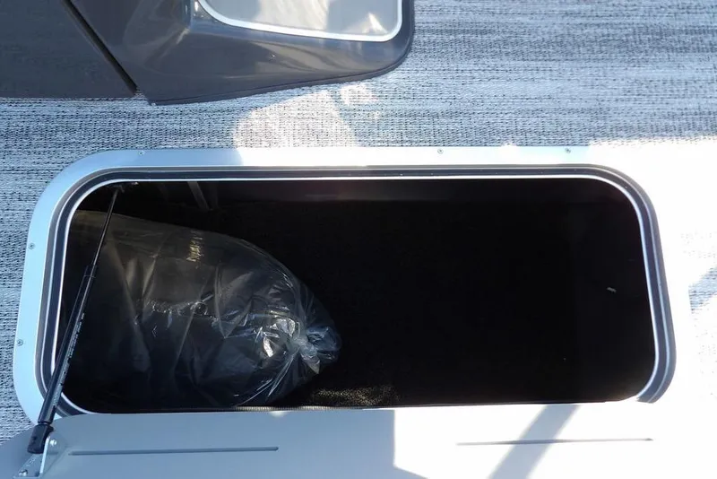 Slide: The Image of Storage compartment of 2026 Bennington M Swingback 22 MSB pontoon boat. - 19