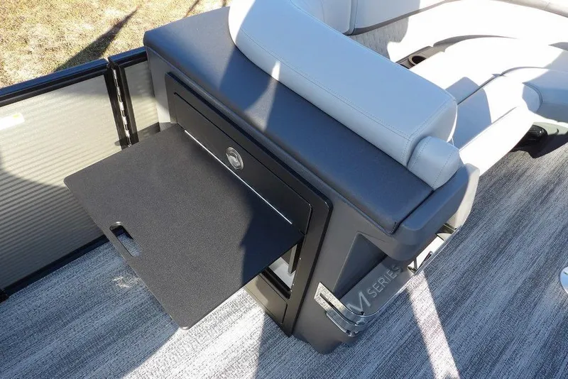 Slide: The Image of 2026 Bennington M Swingback 22 MSB boat interior with storage compartment and seating. - 20