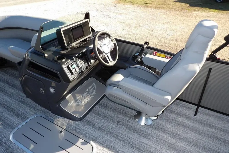 Slide: The Image of 2026 Bennington M Swingback 22 MSB boat interior with modern helm and seating. - 22