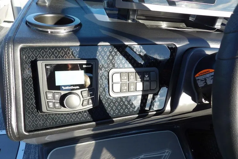 Slide: The Image of Dashboard of 2026 Bennington M Swingback 22 MSB with control panel and cup holder. - 23