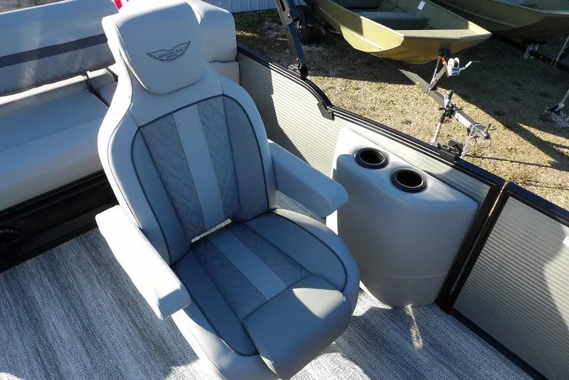 Slide: The Image of 2026 Bennington M Swingback 22 MSB boat interior with luxurious seating and cup holders. - 24