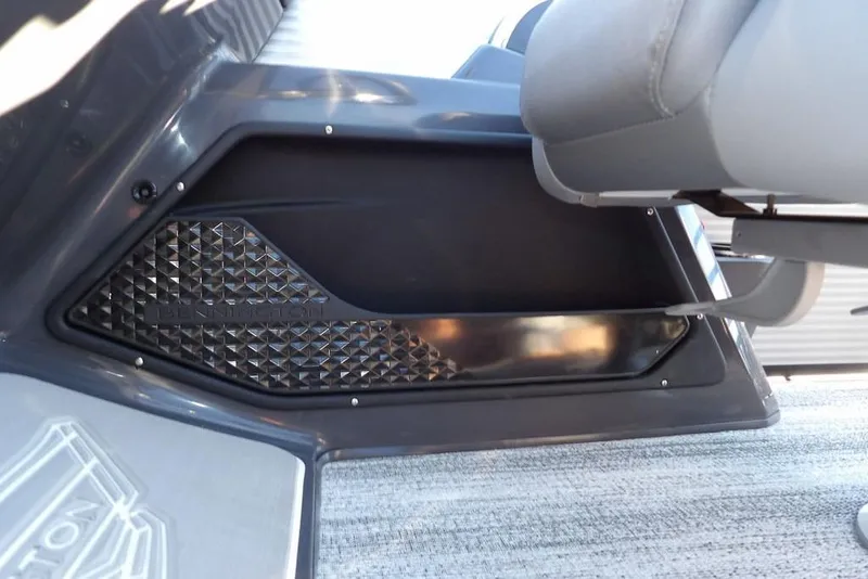 Slide: The Image of Interior detail of 2026 Bennington M Swingback 22 MSB, featuring sleek design and textured panel. - 27