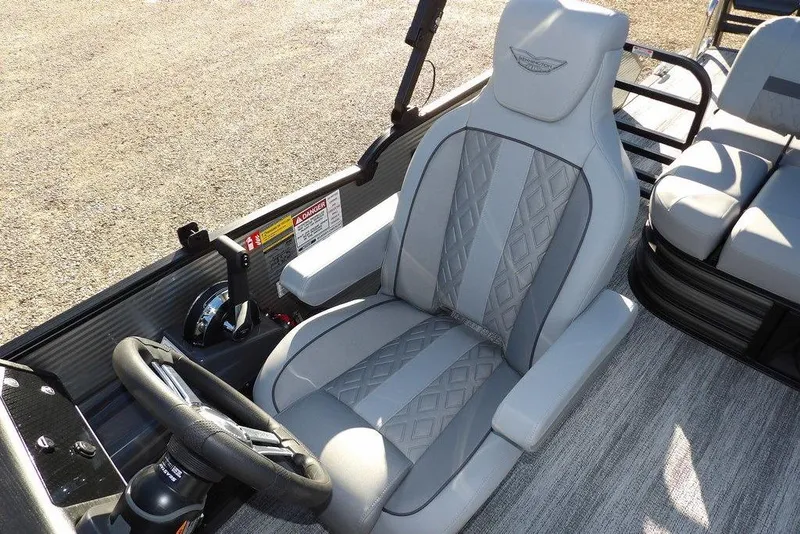 Slide: The Image of 2026 Bennington M Swingback 22 MSB boat interior with luxurious seating and steering wheel. - 29