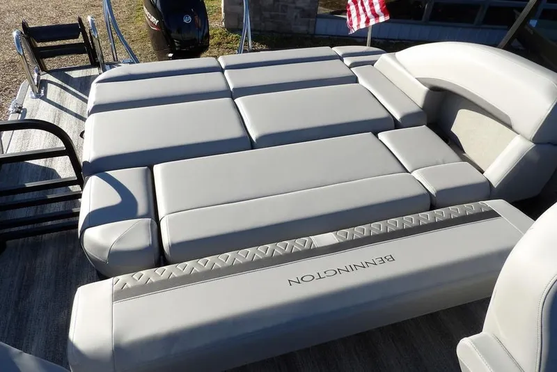 Slide: The Image of 2026 Bennington M Swingback 22 MSB boat with luxurious gray seating and sleek design. - 30