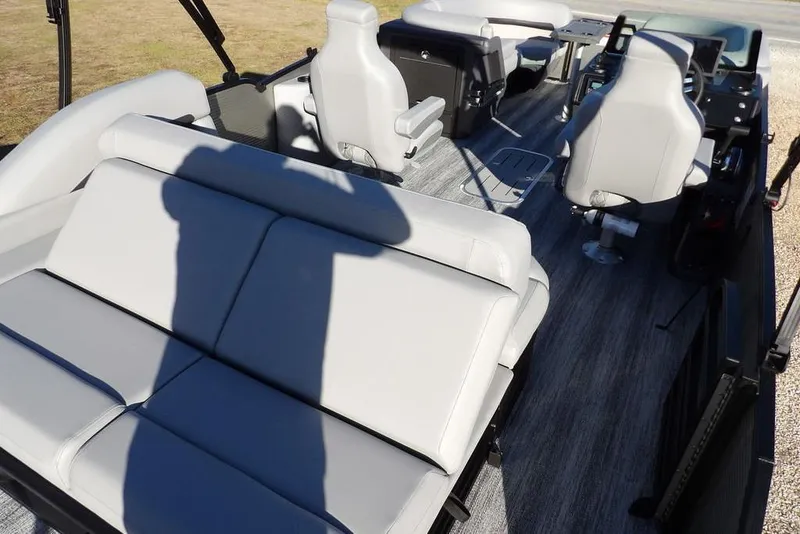 Slide: The Image of 2026 Bennington M Swingback 22 MSB interior with modern seating and steering console. - 38