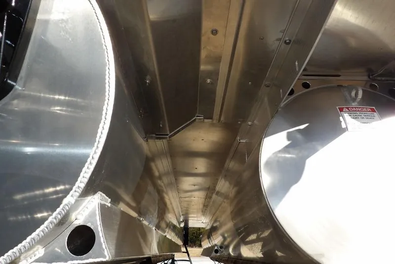 Slide: The Image of Underneath view of 2026 Bennington M Swingback 22 MSB pontoon boat, showcasing metal structure. - 51