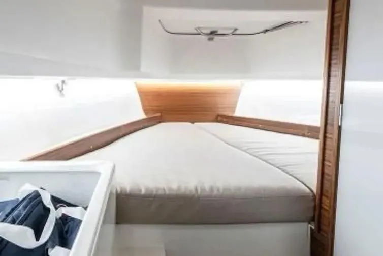 Slide: The Image of Cozy cabin interior of 2021 Nimbus T8 boat with comfortable bedding. - 12