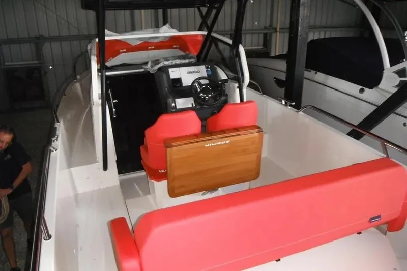 Slide: The Image of Interior of 2021 Nimbus T8 boat featuring modern control panel and ventilation system. - 16