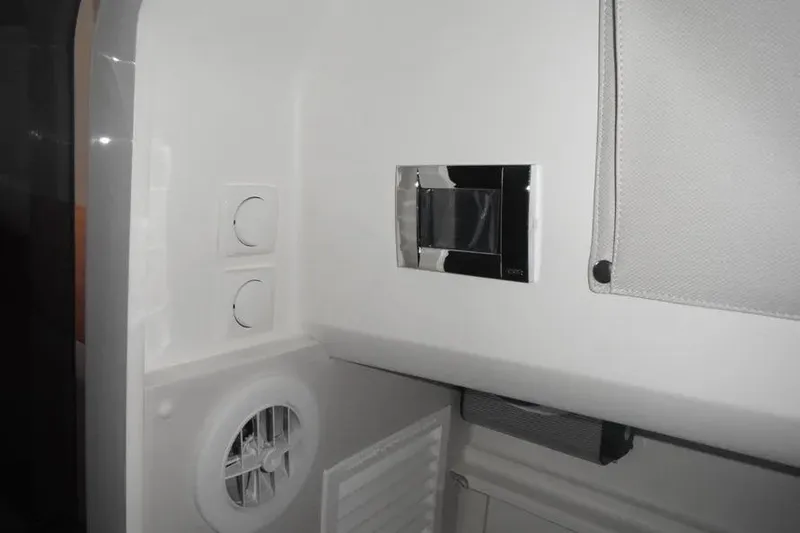 Slide: The Image of Top view of 2021 Nimbus T8 boat interior layout, featuring seating and cabin amenities. - 17