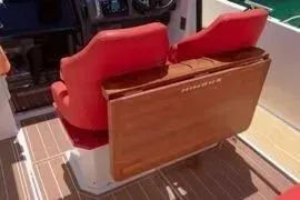 Slide: The Image of 2021 Nimbus T8 boat with Mercury outboard motor and American flag on deck. - 23