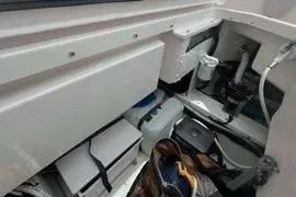 Slide: The Image of 2021 Nimbus T8 boat with red seating and American flag on a sunny day. - 25