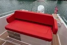 Slide: The Image of Nimbus T8 2021 boat with sleek design, docked by a scenic waterfront. - 27